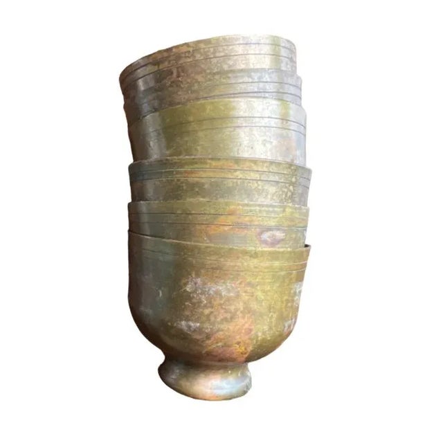 These are wee brass cups for hot tea. Me? I’d pop a small plant in each and line them up on a windowsill. They are...