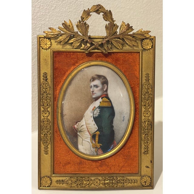 Finely executed hand-painted miniature portrait depicting Napoleon Bonaparte in military uniform with its original Empire...