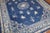an early 20th century room size chinese rug in blues and creams Measures: 8' x 9'9''
