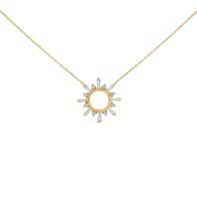 Awaken your everyday with a celestial spark: a radiant starburst pendant traced in polished yellow-gold tone, its open...