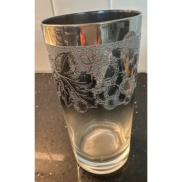 Mid century barware is so exquisite. 4 platinum etched glasses with grapes and leaves and 4 platinum edged coasters all...