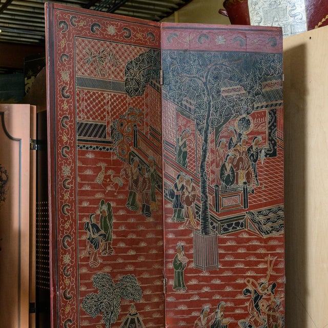 Red Asian room divider screen. Painted with birds, trees, flowers, temples, and figures. Four 16" panels