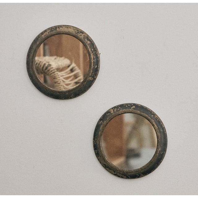 Vintage metal frames that were porthole windows from an old ship newly turned into mirrors. These small scale metal...