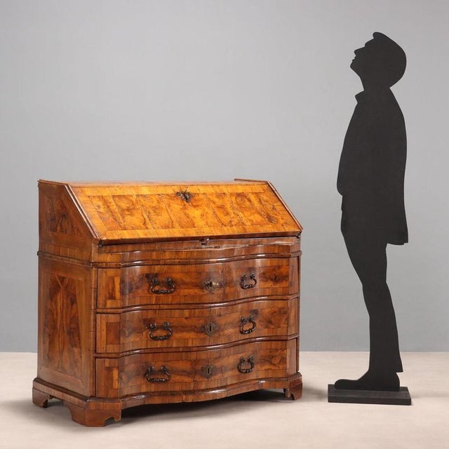 Walnut and burr walnut veneered drop-leaf chest, front with three leaf-spring drawers. Drop-leaf chest conceals a five-...