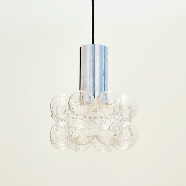 Stunning mid-century pendant/ceiling light by Helena Tynell for Limburg (Germany, 1960s). The transparent hand blown...