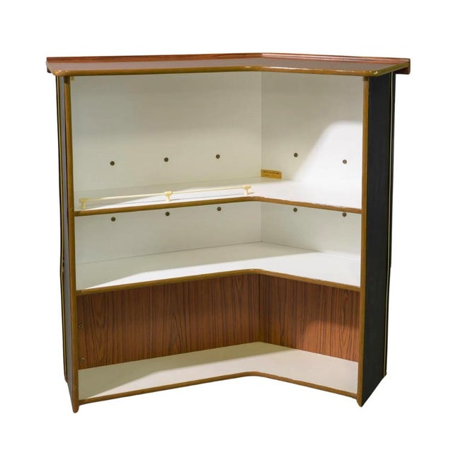 Vintage mid-century modern drinks bar by Barget of London. Features a black leatherette front with solid Afromosia wood...