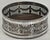 A beautifully detailed Edwardian silver plated wine bottle coaster from Sheffield, England, dating to the early 20th...