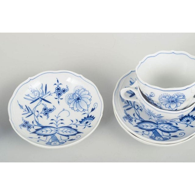 Meissen Blue Onion three coffee cups with matching saucers. Set of three Meissen coffee cups with matching saucers in the...