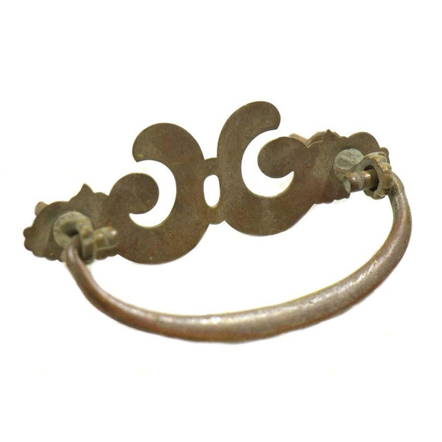 Made of brass with an antique finish. Sold as a pair. The manufacturer and exact date of creation are unknown. The...