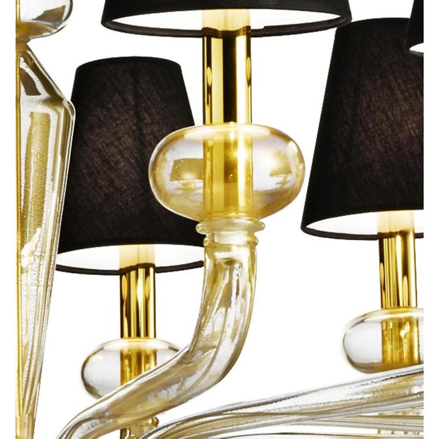 Contemporary luxury italian chandelier in Murano glass. Elegant chandelier blowing in transparent Murano glass full of...