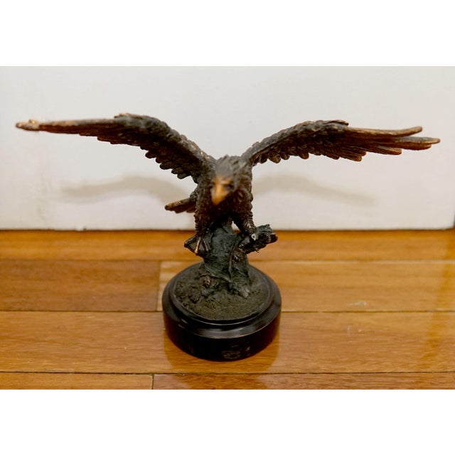This vintage eagle sculpture from the 1970s is regal. It is copper plated and the bird is in attack mode with claws open,...