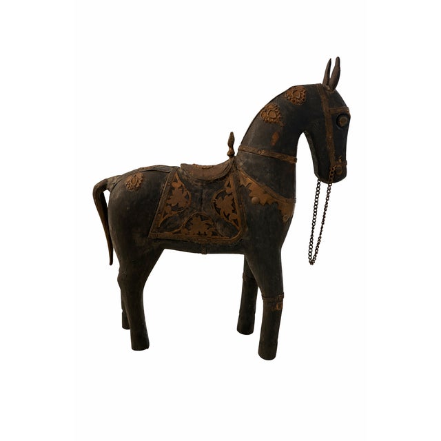 This vintage decorative horse is hand-carved from solid wood and accented with applied copper sheet details, including a...