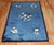 Mid 20th century Chinese Floral design rug in predominantly navy blue Measures: 4'10'' x 7'8''.