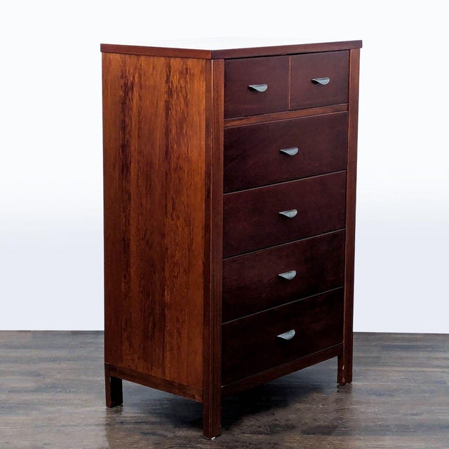 This Ligna Furniture dresser features a rich brown wood finish and six spacious drawers, including two small top drawers...