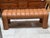 Design Plus Gallery presents a Contemporary Channel-Tufted Upholstered Bench. The sculptural frame is fully wrapped in...