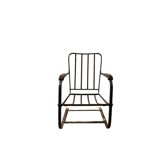 Depression-era steel banded painted chair frame "as-found" ... chippy brown paint over orange inspiring new cushions in...