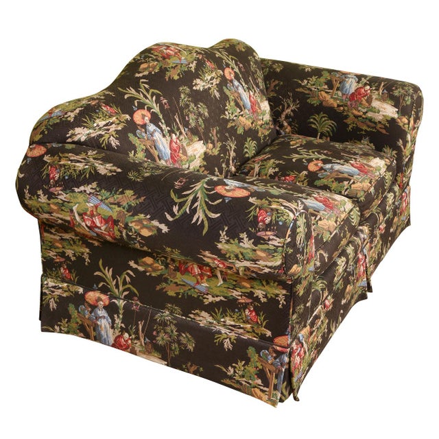 A whimsical camelback sofa with a tight back, two loose seat cushions and rolled arms, covered in a lively chocolate brown...