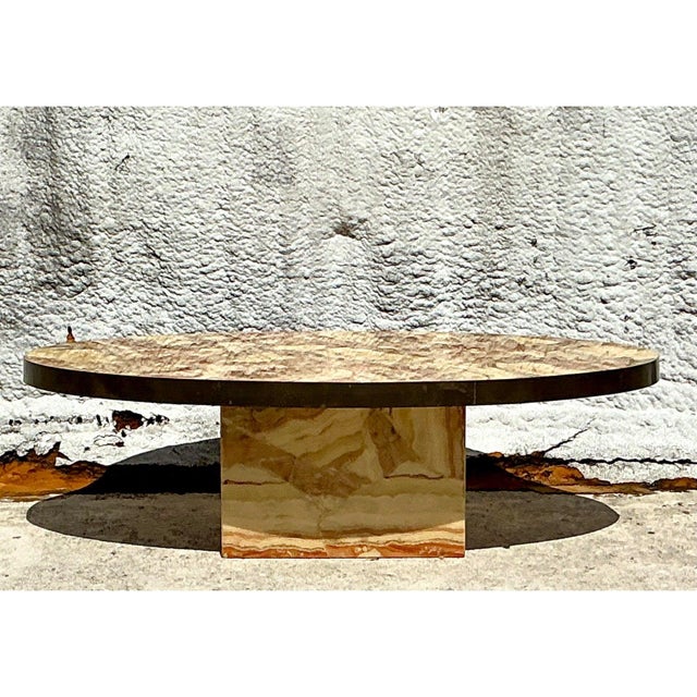 This exceptional coffee table is a testament to the luxurious material use and sculptural forms favored in Italian Mid-...