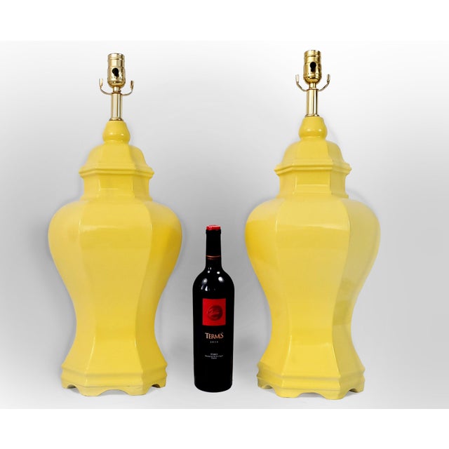 Offering a pair of restored LARGE vintage temple/ginger jar table lamps with high gloss yellow glaze, circa 1960s. These...