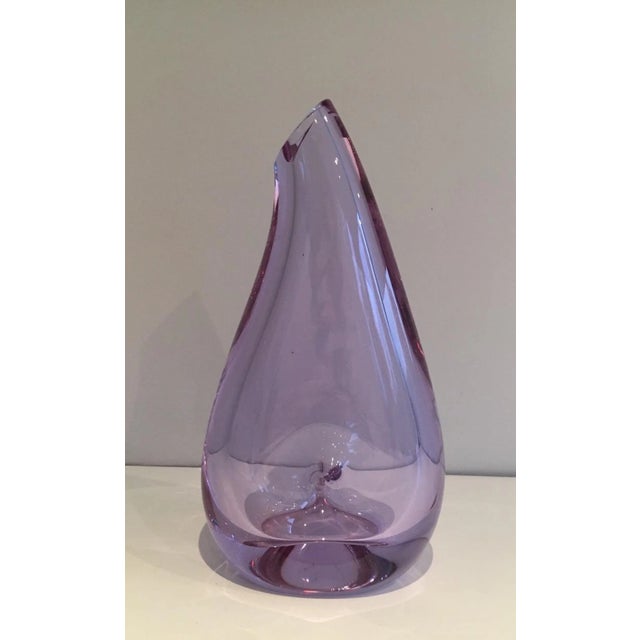 This vase is ma de of a glass purplish-colored pear-shaped. This is a French work. Circa 1970.