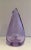 This vase is ma de of a glass purplish-colored pear-shaped. This is a French work. Circa 1970.