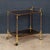 An elegant Italian bar trolley dating from the 1970s. The piece features a refined structure in polished brass with clear...
