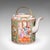 This is an antique Famille Rose teapot. An Oriental, ceramic Chá pot with padded wicker case, dating to the early 20th...