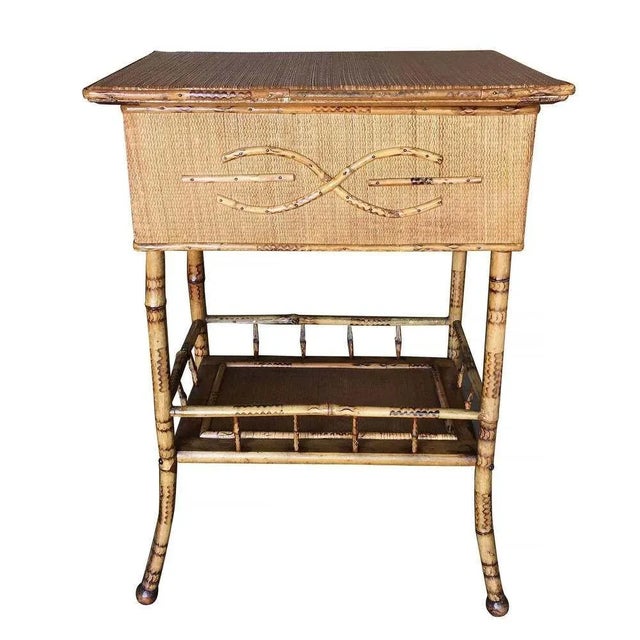 Antique tiger bamboo pedestal side table with rice mat top with flip-open lid storage and a secondary bottom shelf. 1900,...