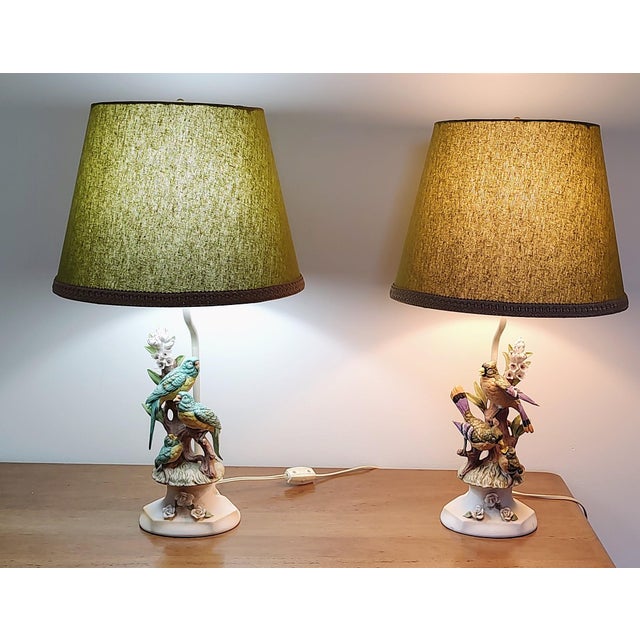 Pair of Vintage Porcelain bird lamps with handmade matching linen shades. These beautiful lamps will add a lovely vintage...