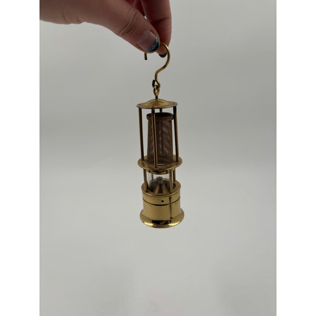 Miniature brass miner's lamp, made in West Germany, decorative and, according to the seller, unused. The lamp is intended...