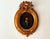 A captivating antique portrait painting dating to the 19th century (1800s), depicting a young boy dressed in a blue coat...