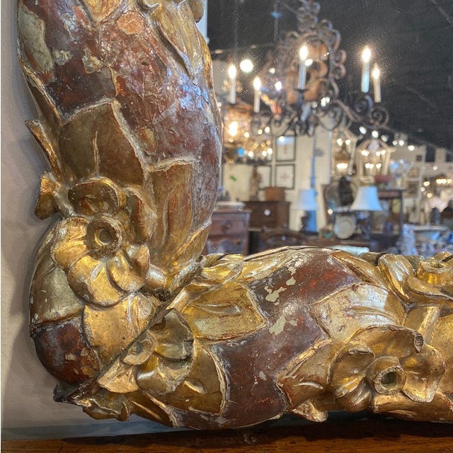 Pair of Italian mirrors made of 17th c gold gilt floral fragments with new mirror. 48” square 38-113