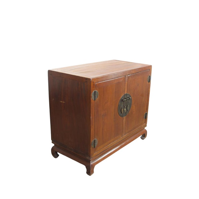 This cabinet’s hand rubbed finish shows off the natural wood color and grain of solid elm. Its handmade brassware and...