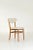 A set of four mid-century dining chairs designed by Elias Svedberg for NK (Nordiska Kompaniet) in Sweden. This design...