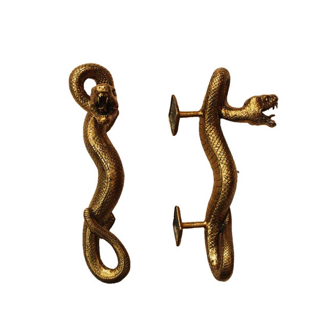 Striking pair of handcrafted brass door pull handles in the form of sculptural snakes, France, circa 1960s. Each handle...