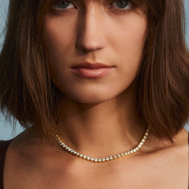 Simply stunning. Most tennis necklaces don't come with an extender chain. Ours does, because we made it to easily mix into...