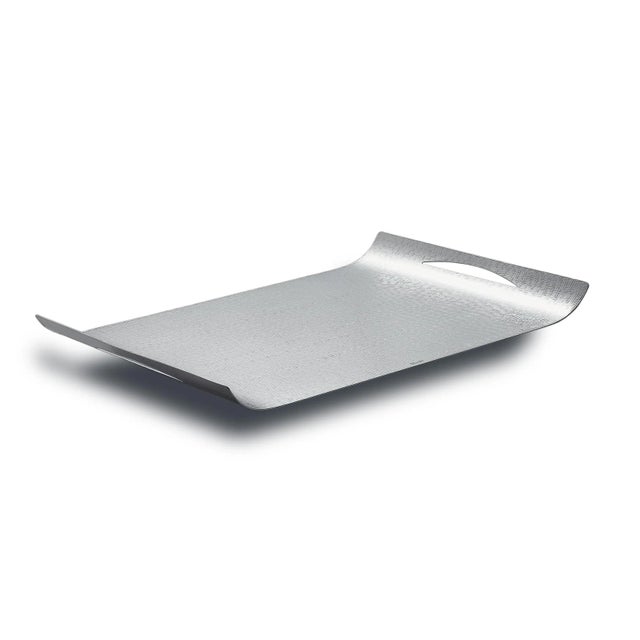 This is a glossy silver alloy Uno tray in a rectangular shape with curved edges.