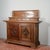 Art deco sideboard in solid wood with top and drawers carved with fasces: doors decorated with bas-reliefs carved with the...
