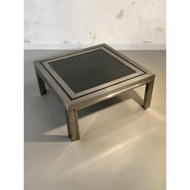 A rigorous and powerful square coffee table, post-modernist, kinetic, constructivist, shabby-chic, complex constructivist...