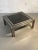 A rigorous and powerful square coffee table, post-modernist, kinetic, constructivist, shabby-chic, complex constructivist...
