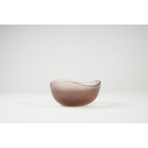 Glass bowl with a pink, wheel-turned surface. Manufactured by venini. Date: 1960. Dimensions: l 15 – w 14 – h 7.5 cm i...