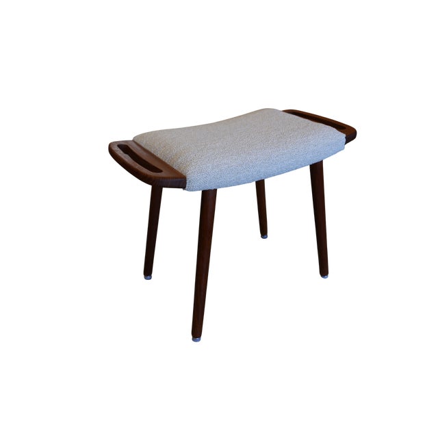 A very well-made Danish stool in teak with an expression that really catches the eye. The softly shaped handles on the...
