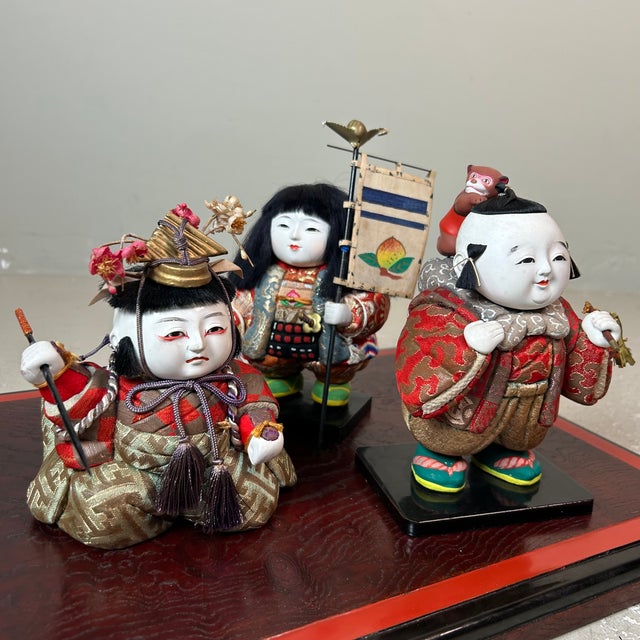 This exquisite set of three Gosho Ningyō (御所人形), also known as "palace dolls," is a unique and atmospheric representation...