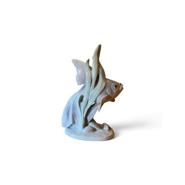 Elegant vintage porcelain figurine of a fish, manufactured by Metzler & Ortloff, Ilmenau, Germany, dating from the 1920s....
