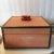 Beautiful coral colored shagreen box. The lid has a piece of real coral wrapped in wire. This box has brass surrounding...