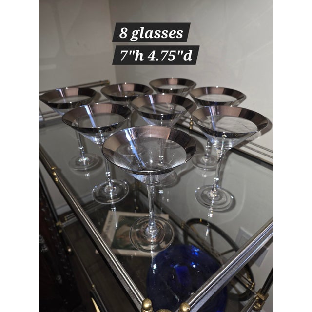 Eight vintage silver rimmed martini glasses.