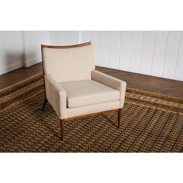 An Indian Agra antique rug having a dense allover pattern of miniature beige botehs on a black field within a series of...