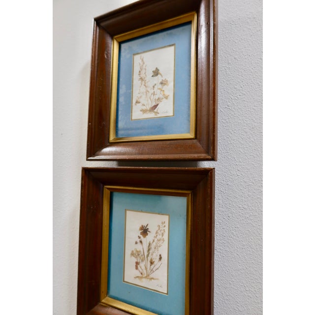A pair of vintage Erika Originals pressed flower artworks from mid-century Switzerland — part of a small tradition of...