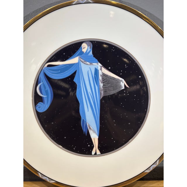 A vintage porcelain collector plate featuring “Moonlight” by celebrated Art Deco artist Erté. Produced in Germany in 1988,...