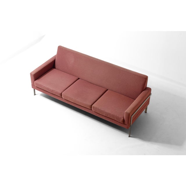 minimalist 1960s sofa by Gelderland Holland, finished in a muted pink fabric. The frame is made from brushed metal and...